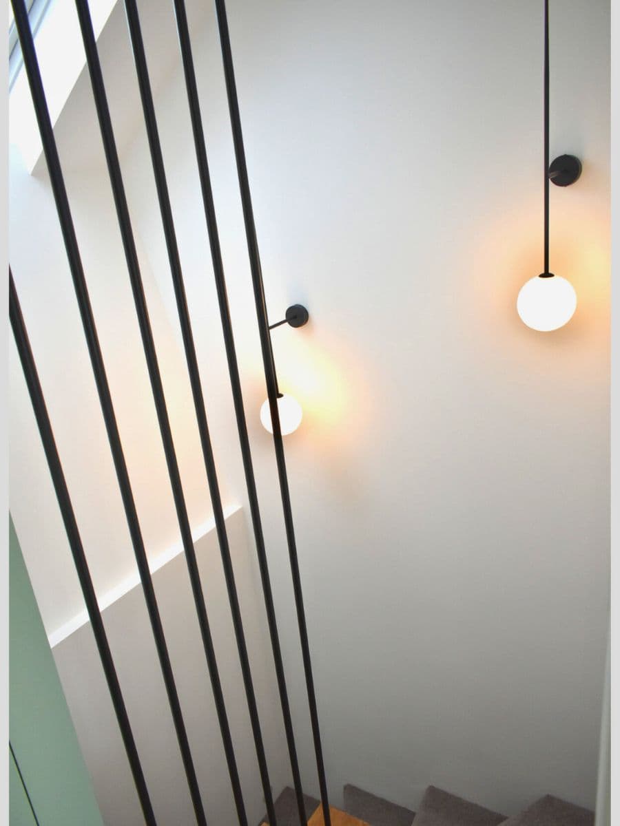 Stair wall lighting installation in a New Malden home